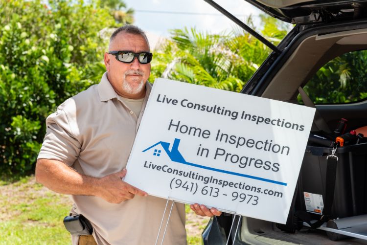Ed Wood Holding Live Consulting Inspection Sign